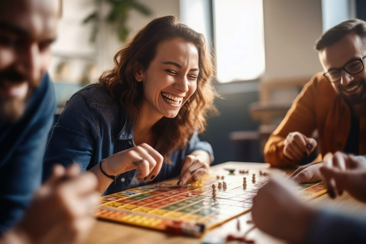 Image shows patients playing a board game at a local club